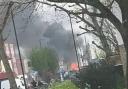 Fire destroyed a caravan and damaged hoardings and part of a bus shelter in Enfield
