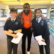Wretch 32 (centre) with students Jack (left) and Amira (right)