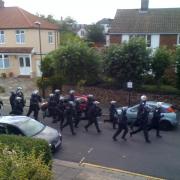 Clashes between rioters and police in Enfield Town