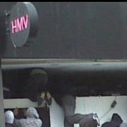 Rioters enter the HMV store in Church Street.