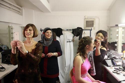 Backstage the contestants touch up their hair and make-up before the big show