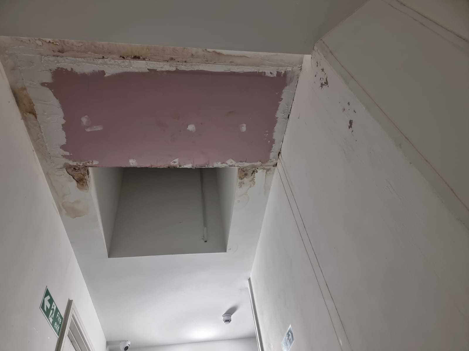 A photo showing leaks and water damage at the housing block