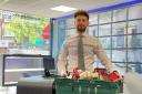 Dario from Martyn Gerrard estate agent's with a food bank collection box for Food Bank Aid.Credit: Martyn Gerrard Estate Agents