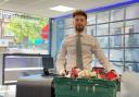 Dario from Martyn Gerrard estate agent's with a food bank collection box for Food Bank Aid.Credit: Martyn Gerrard Estate Agents