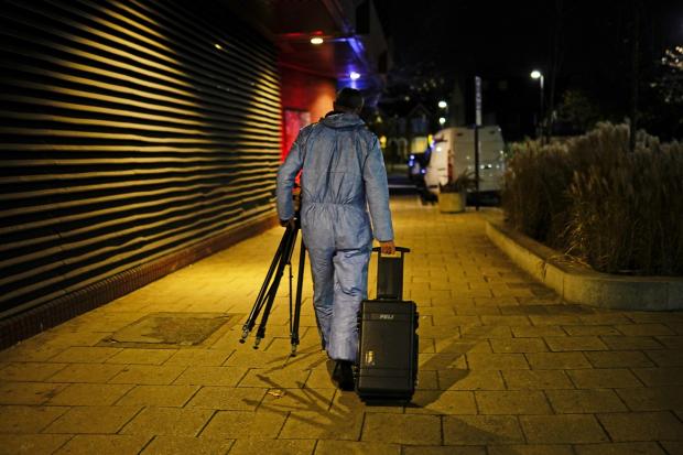 Enfield Independent: A forensic officer near the scene in Mayes Road, Wood Green. Credit: PA