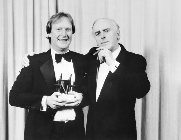 Enfield Independent: Minder stars, Dennis Waterman (left) and George Cole with the Editor's Special Award for the programme at the TV Times magazine's awards ceremony. Picture: PA