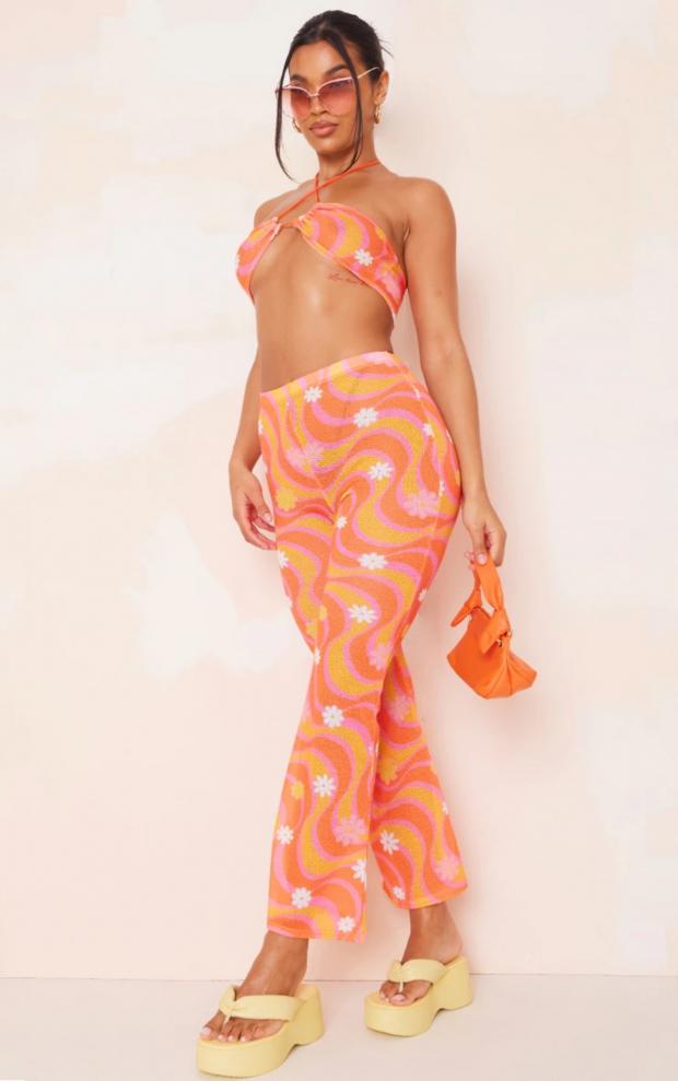 Enfield Independent: Orange Flower Swirl Print Knit Flare Trousers (PrettyLittleThing)
