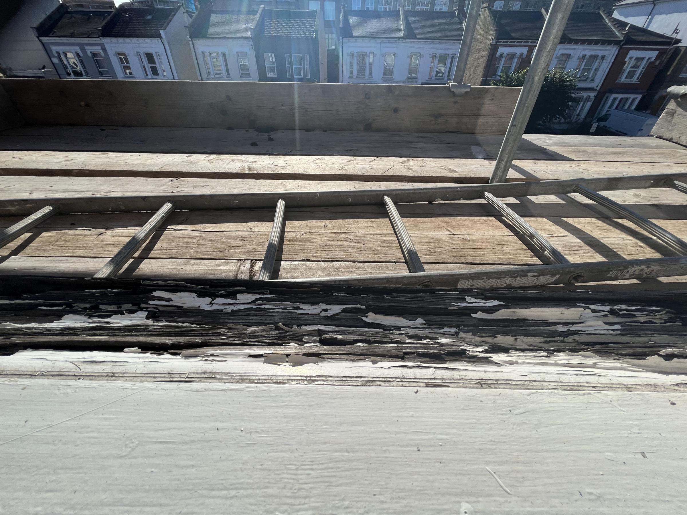 Scaffolding was left up around the house while a rotting windowsill went unfixed. Photo: Roxanne Misir
