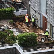 Contractors undertake works at a residential property in Paddington, London, in 2021 as part of a project to remove and replace non-compliant cladding. Credit: PA
