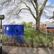 Travellers set up camp near an entrance of Winchmore School
