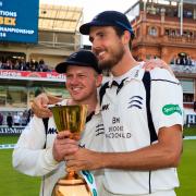 Sam Robson and Steven Finn celebrate winning the County Championship with Middlesex in 2019