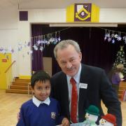 MP Andy Love with Christmas card competition winner Tanbir Chowdhury yesterday