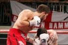 Sam Couzens (right) is forced to take evasive action as Frank Buglioni takes charge. Picture: Action Images
