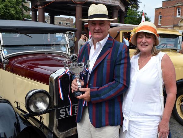 Peter Read with his trophy and vintage car