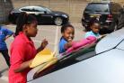 Children helping out at the Revival Christian Church's car wash day