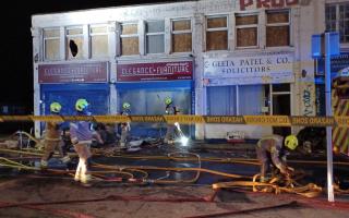 Fire destroyed the ground floor and staircase of a building of shops and homes in North Circular Road in Arnos Grove, Enfield